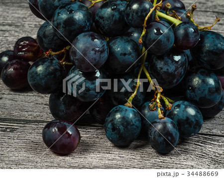 Red grapes on the table 34488669