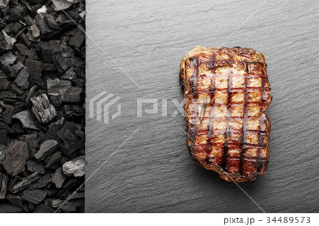 grilled steak on the coals grilled steak on the coals 34489573