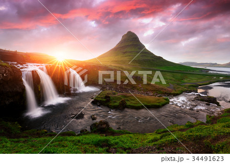 Colorful sunrise on Kirkjufellsfoss waterfall Colorful sunrise on Kirkjufellsfoss waterfall 34491623