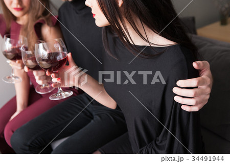 Male flirting with female on party with drinks 34491944