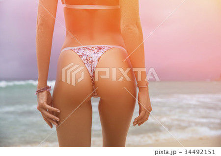 Sporty back of a beautiful woman in bikini 34492151