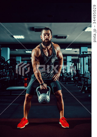 Fitness Kettlebells swing exercise man workout at Fitness Kettlebells swing exercise man workout at 34495029