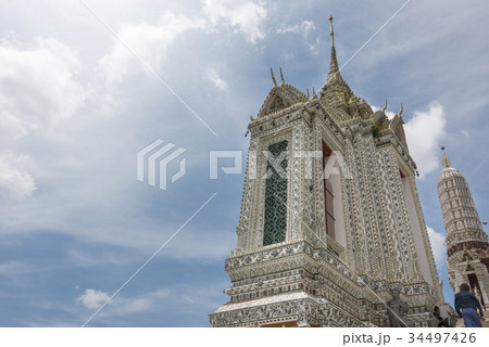 Thai style temple decoration of mosaic on blue sky 34497426