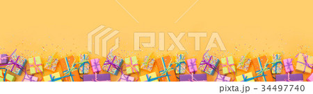 Colored gift boxes with colorful ribbons.  34497740