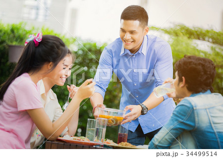 A man holding a soup Thailand raises food groups. 34499514