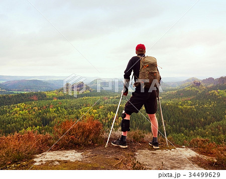 View over edge into valley full of autumnal mist 34499629