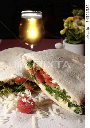 Panuozzo with tomatos, arugula, mozzarella and 34501582