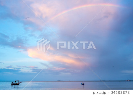 Rainbow and cloudy blue sky Rainbow and cloudy blue sky 34502878