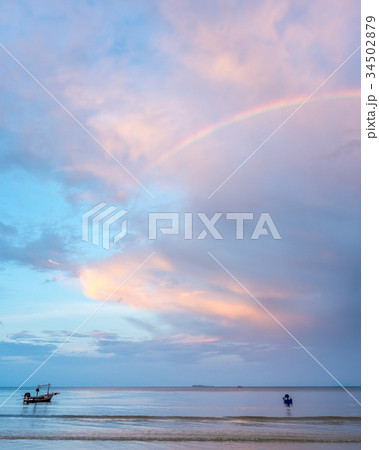 Rainbow and cloudy blue sky Rainbow and cloudy blue sky 34502879