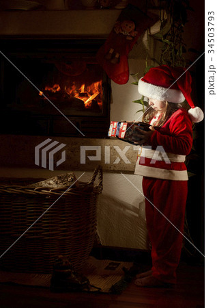 Little caucasian girl disguised as Santa Claus 34503793