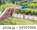a woman hand holding pregnancy test 34503966