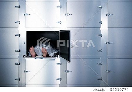 Grungy photo of feet  on a morgue table 34510774