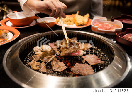 Raw beef and pork slice on grille for barbecue 34511328