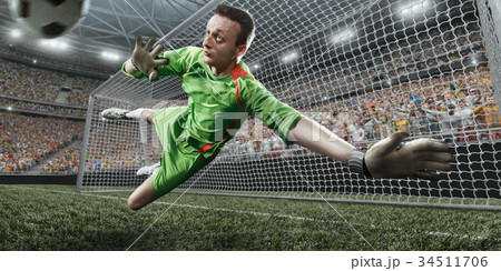 Soccer goalkeeper catches a ball 34511706