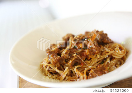 Beef stew spaghetti on wood background Beef stew spaghetti on wood background 34522000