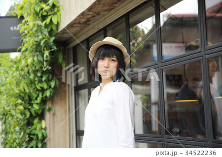 Asian young woman thinking and looking portrait with in coffee shop 34522236