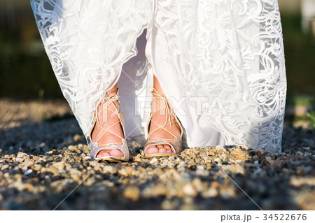 Feet of a bride in wedding dress Feet of a bride in wedding dress 34522676