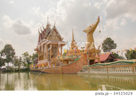 Thai boat shaped church in a small lake. 34525029
