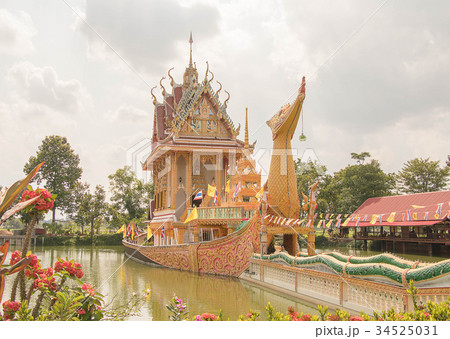 Thai boat shaped church in a small lake. 34525031