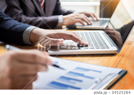 Business man analysed report of profit finance data graph docume 34525264