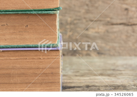stack of old books on wooden background stack of old books on wooden background 34526065