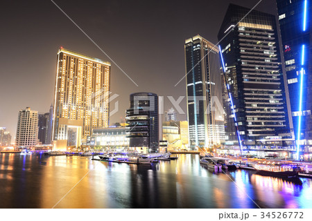 The night illumination of Dubai Marina, UAE The night illumination of Dubai Marina, UAE 34526772