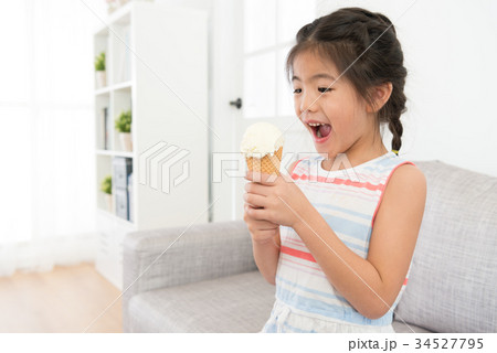 happy cheerful little girl kid holding ice cream 34527795