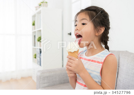 young pretty female children eating ice cream young pretty female children eating ice cream 34527796