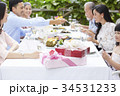 two colorful presents are on the table of a family party in a luxurious restaurant 34531233