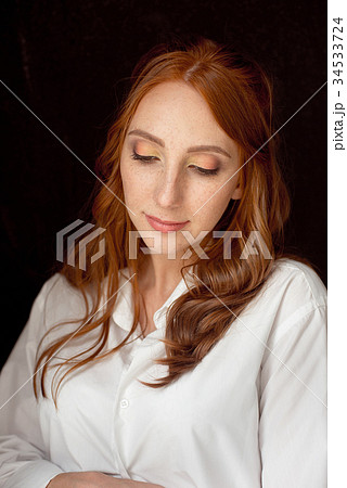close up portrait of young red-haired woman on 34533724