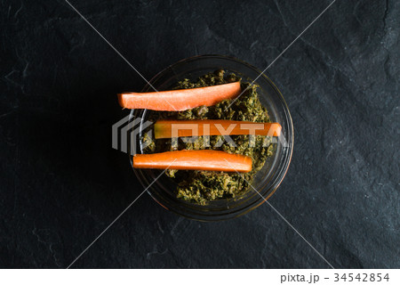 Pesto of carrot tops and carrots on background 34542854