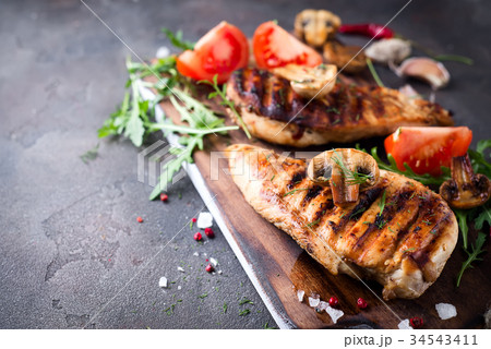 Closeup of two grilled chicken breasts 34543411