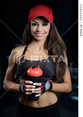 Sexy athletic young girl working out in gym Sexy athletic young girl working out in gym 34543631