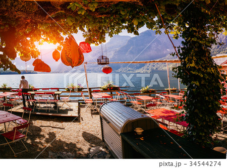 Summer cafe on the shore of a mountain lake 34544274