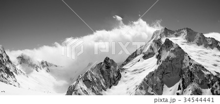 Black and white panoramic view on snow mountains 34544441