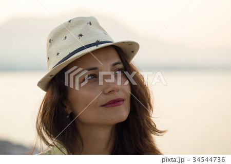 portrait of woman wearing beige hat  34544736