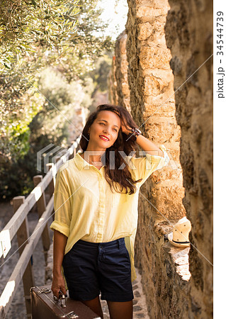 Traveler woman with vintage suitcase 34544739