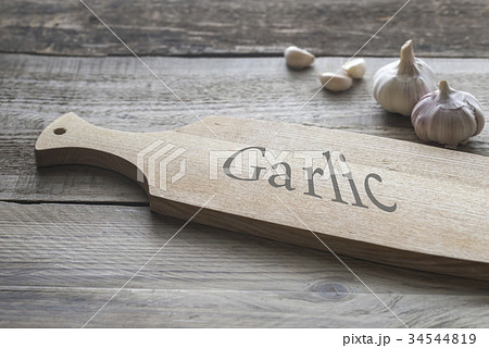 Garlic on the wooden background 34544819