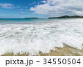 Waves in the sea and sand on the beach. 34550504