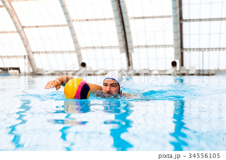 Water polo player in a swimming pool. 34556105