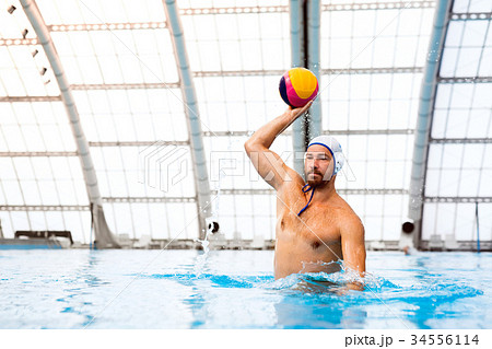Water polo player in a swimming pool. 34556114