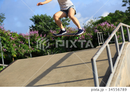 woman skateboarder skateboarding at skatepark woman skateboarder skateboarding at skatepark 34556789