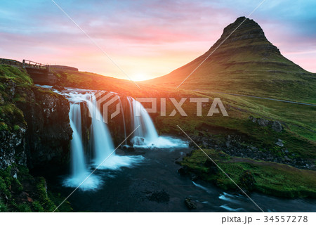 Colorful sunrise on Kirkjufellsfoss waterfall 34557278