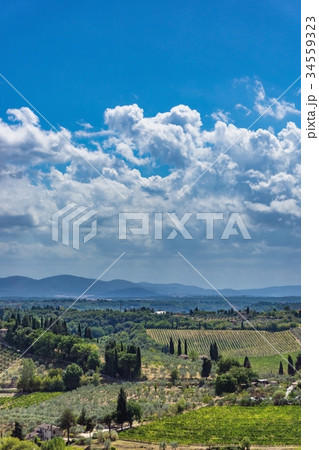 View into Tuscany countryside with clouds View into Tuscany countryside with clouds 34559323