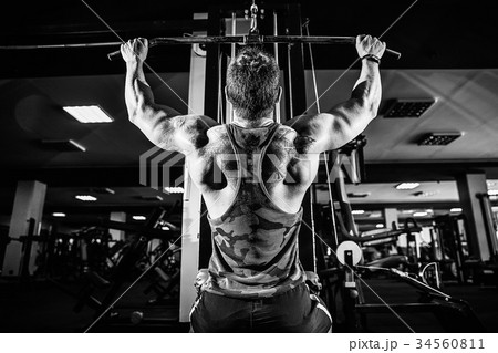 Strong Bodybuilder Doing Heavy Weight Exercise For Strong Bodybuilder Doing Heavy Weight Exercise For 34560811