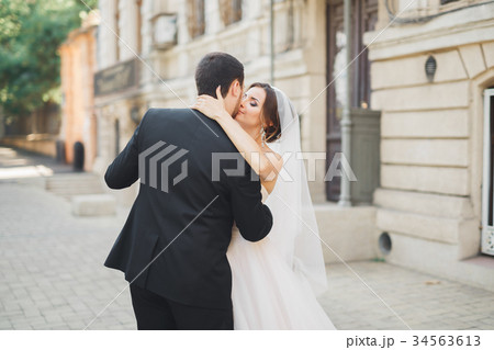 Romantic couple dancing and kissing on their Romantic couple dancing and kissing on their 34563613