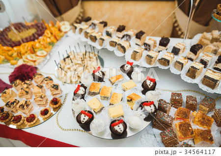 Different kinds of baked sweets on a buffet 34564117