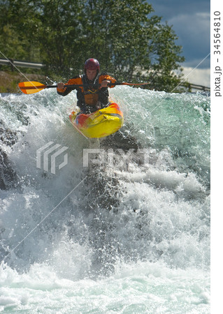 Kayaker on whitewater 34564810