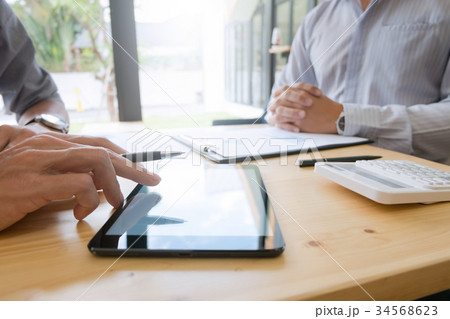 Business people working together and using tablet Business people working together and using tablet 34568623