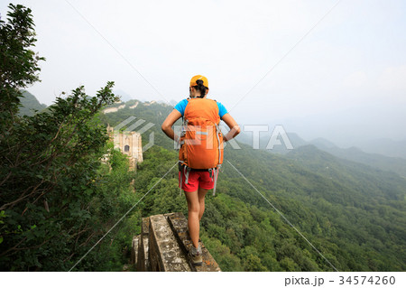 young woman hiker hiking on great wall 34574260